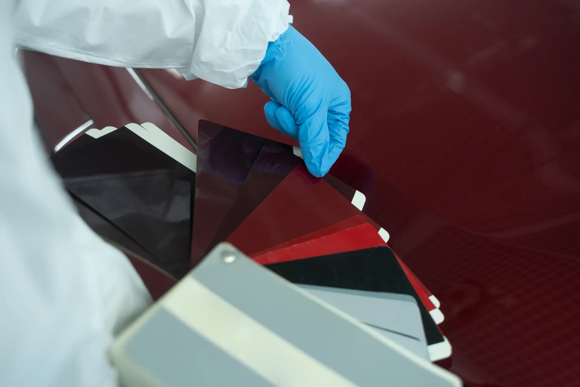 car-painter-chooses-auto-body-color-with-samples